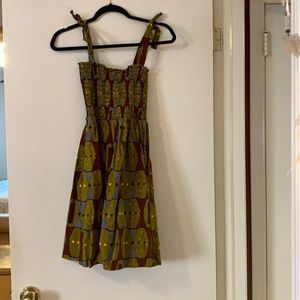 The Royal Native Smocked Strap Mini Dress in Olive Geometric Print